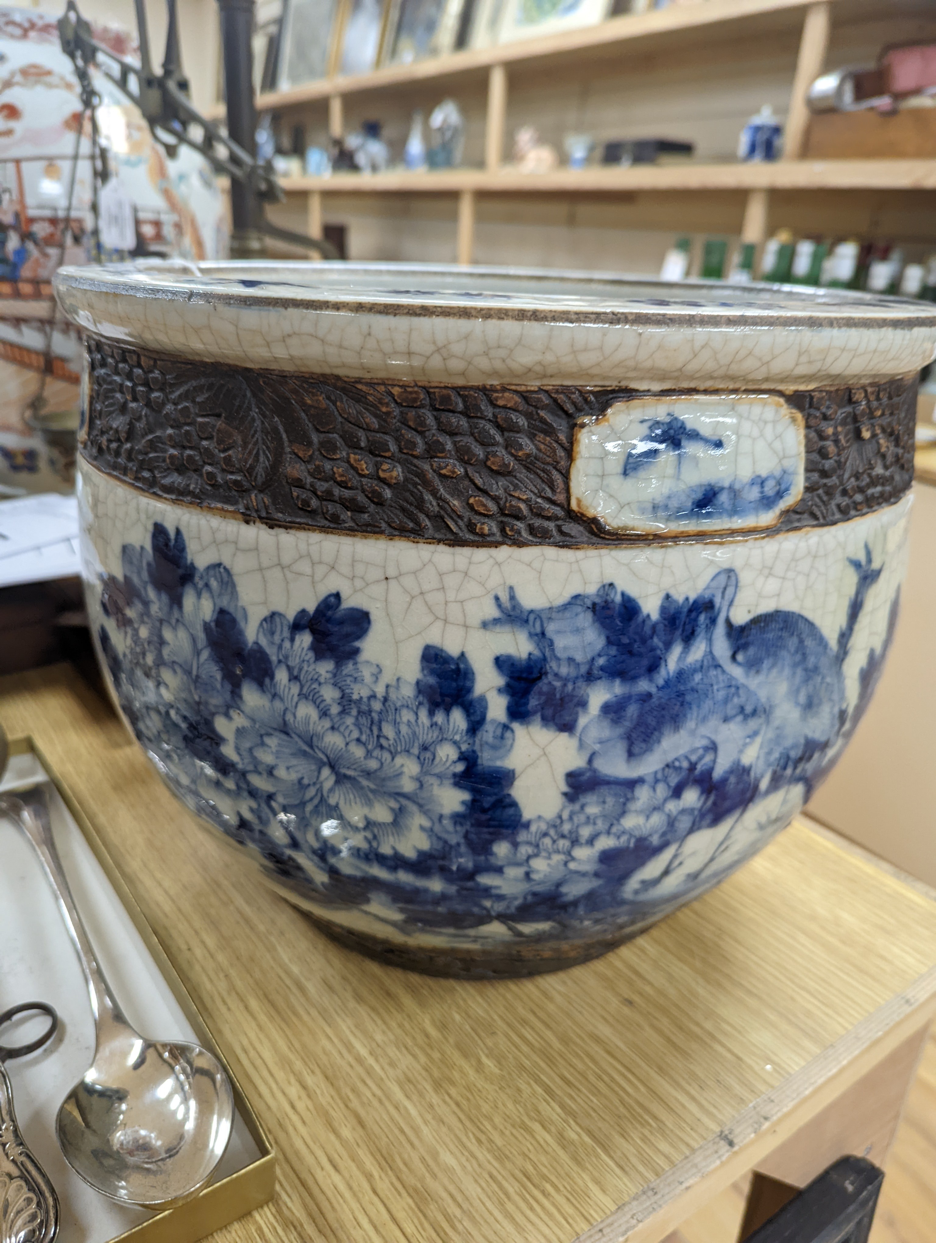A late 19th/early 20th century Chinese blue and white crackleglaze jardiniere 30cm